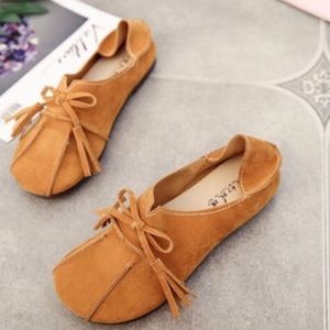 Women’s tan suede loafers, size 6.5.